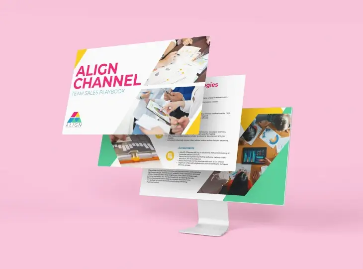 Computer monitor displaying a digital presentation titled 'ALIGN CHANNEL Team Sales Playbook' with photos of people collaborating and charts on a pink background.
