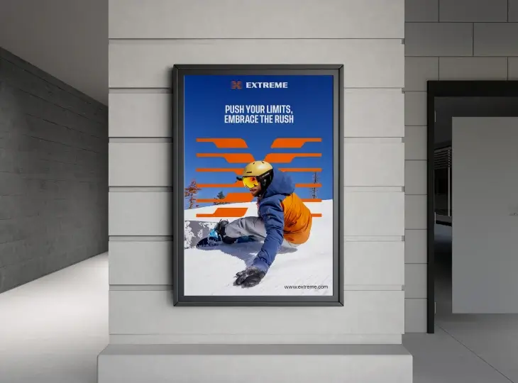 Poster of a snowboarder in orange and blue gear wearing a yellow helmet, snowboarding on a slope with text 'EXTREME PUSH YOUR LIMITS, EMBRACE THE RUSH' and a website link.