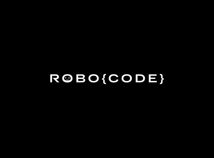 Black background with the word 'ROBO{CODE}' in white letters, featuring a smiling robot face inside the first O.