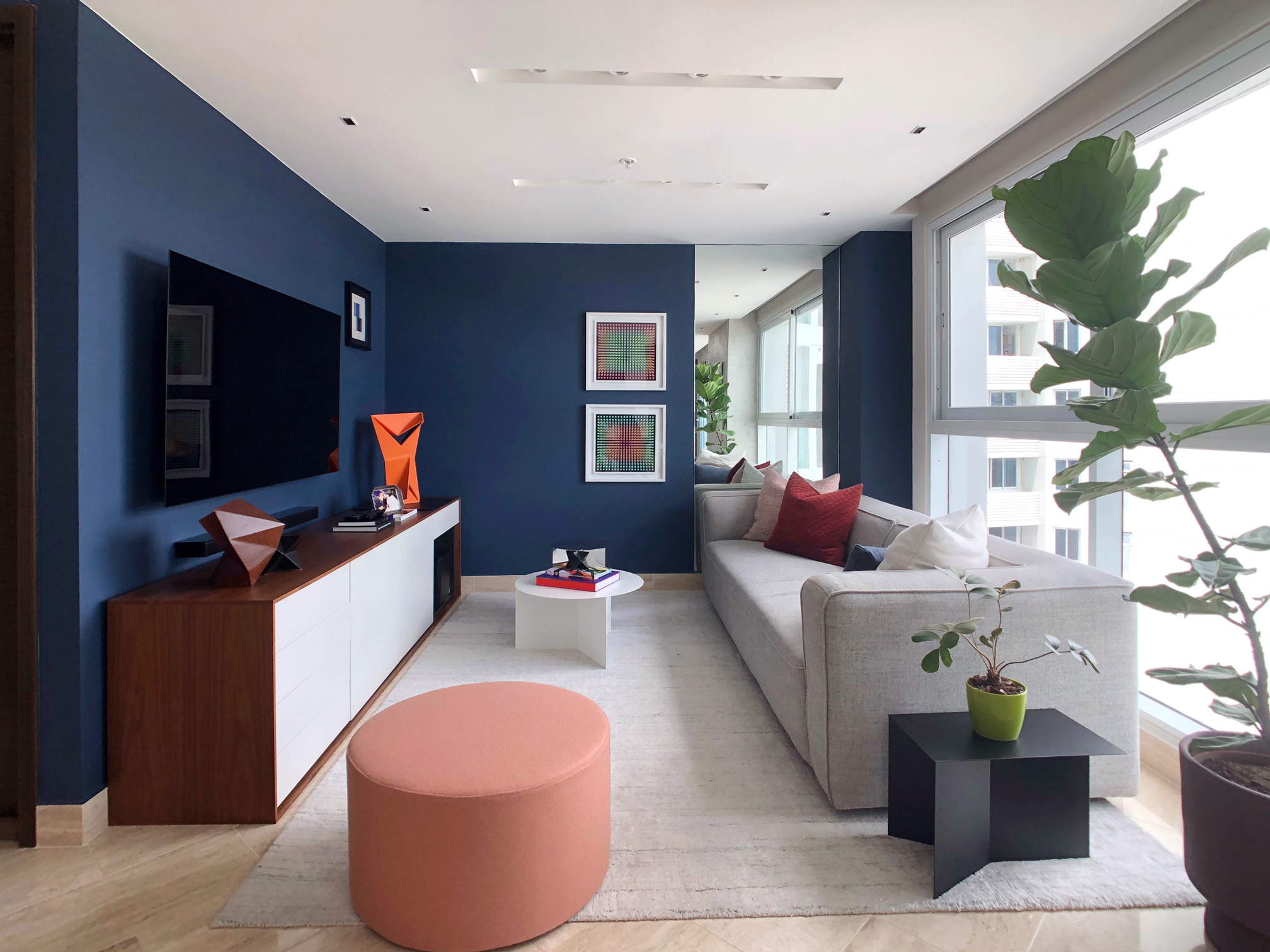 Contemporary living room with vibrant color accents in Costa del Este