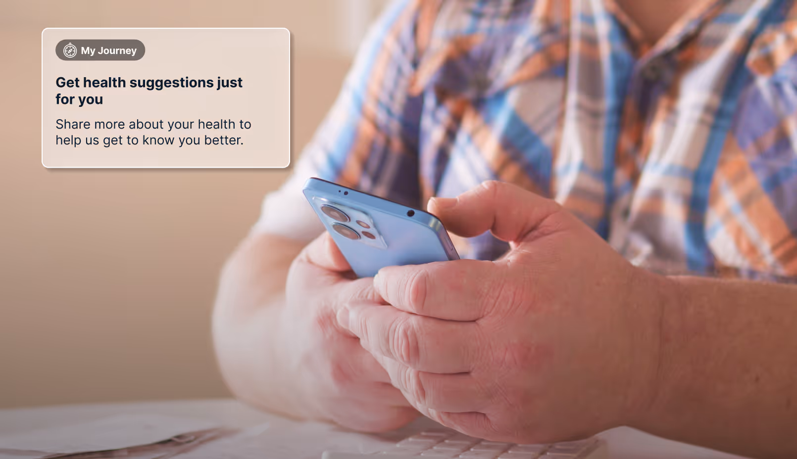 Person wearing a plaid shirt holding a smartphone with a text box stating 'Get health suggestions just for you' and a prompt to share more about your health.