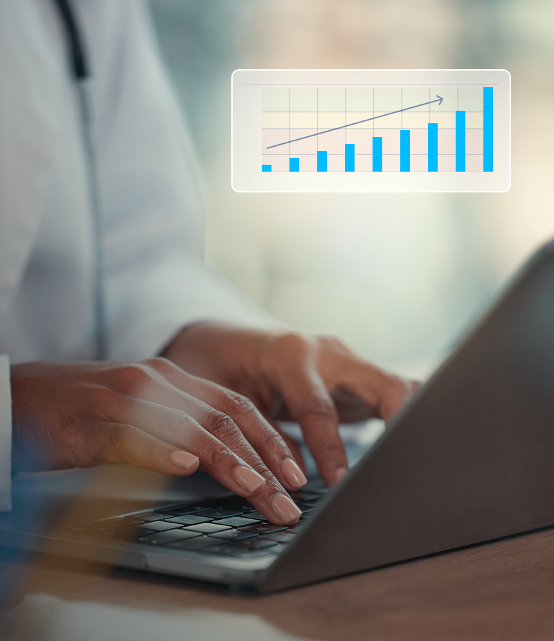 Clinician typing on a laptop beside a rising bar chart representing value-based care contract performance for health systems
