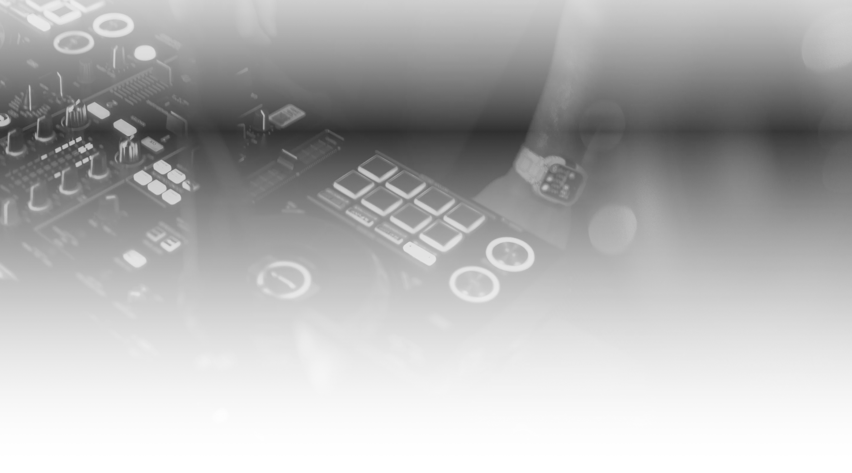 Close-up of DJ controller pads and knobs