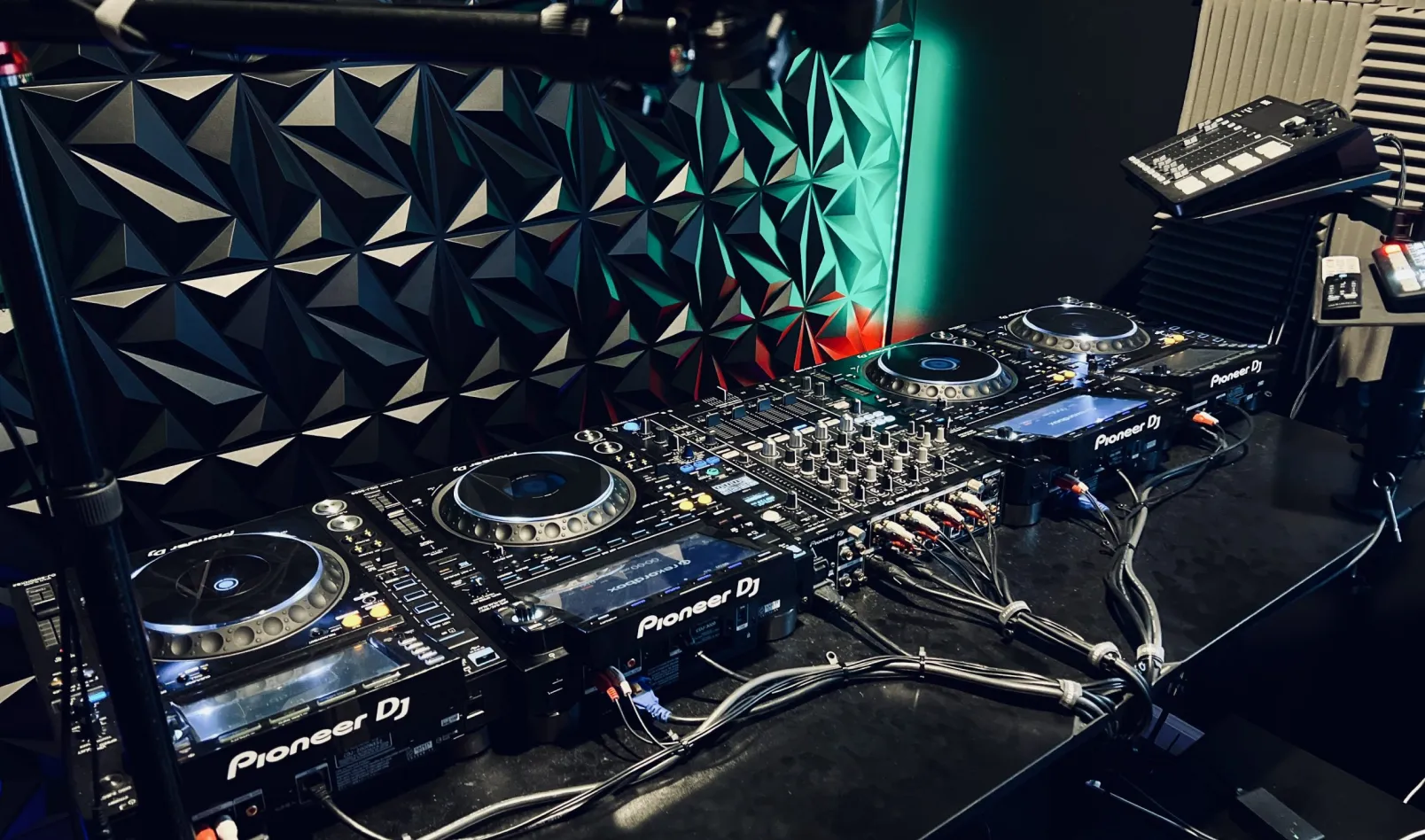 Empty DJ booth with Pioneer decks and mixer