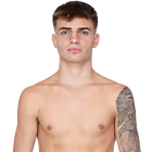 Young shirtless man with short brown hair and a tattoo sleeve on his right arm, standing against a plain white background.