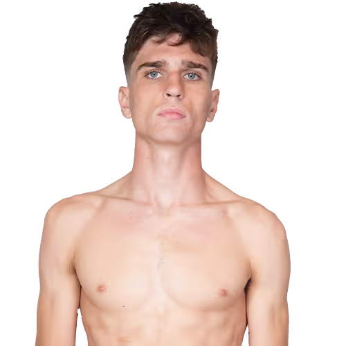 Young man with short brown hair and blue eyes, shirtless, looking straight ahead.