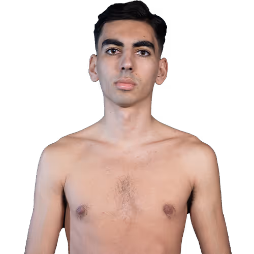 Young man with short dark hair standing shirtless, facing forward with a neutral expression.