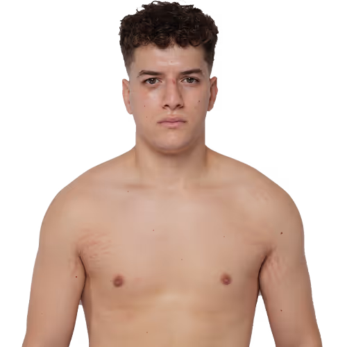 Portrait of a young man with curly short hair, bare-chested, looking straight ahead with a neutral expression.