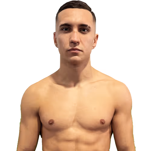 Young man with short dark hair, no shirt, facing forward with a neutral expression.