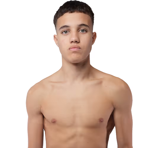 Portrait of a young shirtless man with short dark hair and neutral expression on a white background.