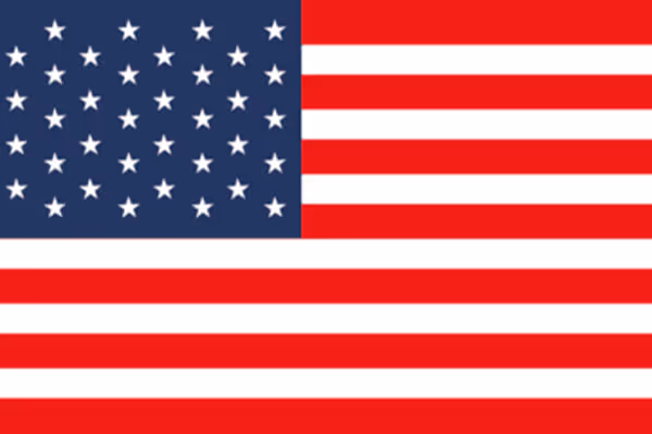 United States flag with 50 white stars on a blue field and 13 red and white stripes.