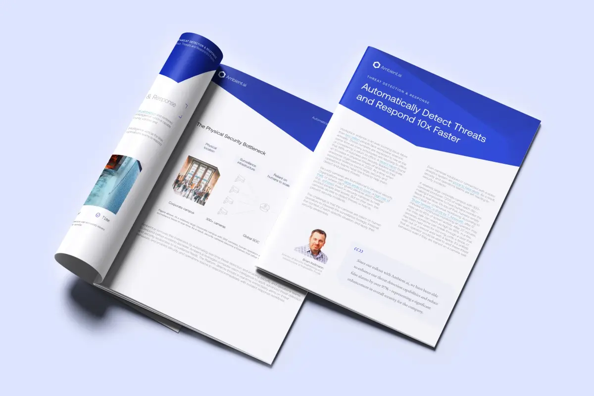 Open whitepaper titled 'Automatically Detect Threats and Respond 10x Faster' by Ambient.ai, showing text, a photo of a man, and a page on physical security bottlenecks with images and diagrams.