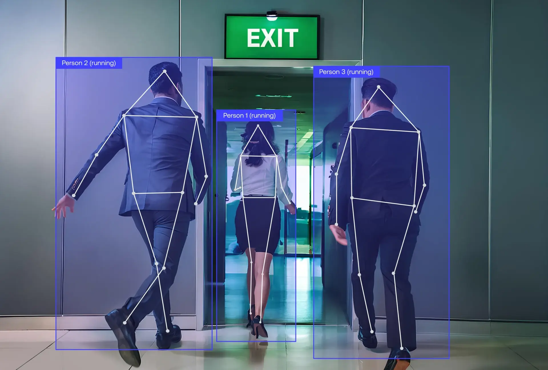 Two men and a woman in business attire walk through through an exit. They are labelled as running.