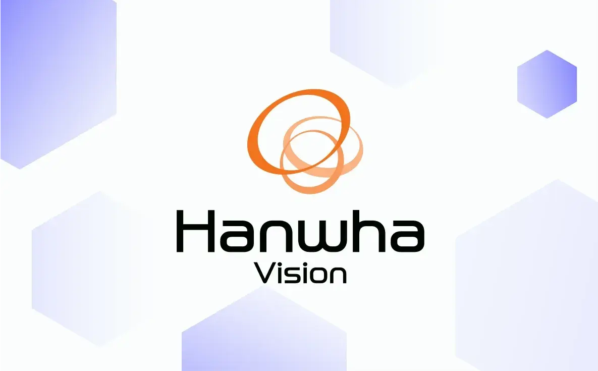 Hanwha Vision logo on a white background with light purple hexagonal shapes.