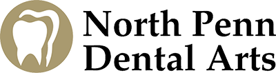 Logo of North Penn Dental Arts featuring a stylized white tooth inside a gold circle next to the text.