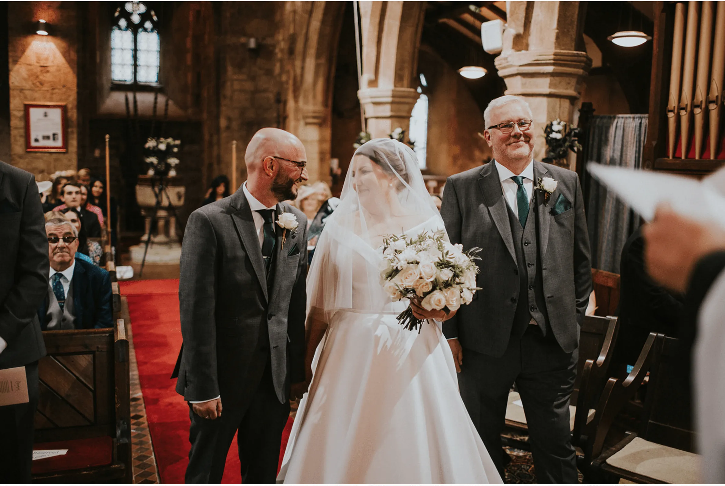 Soon to be married couple pictured at the top of the aisle in the church hall.