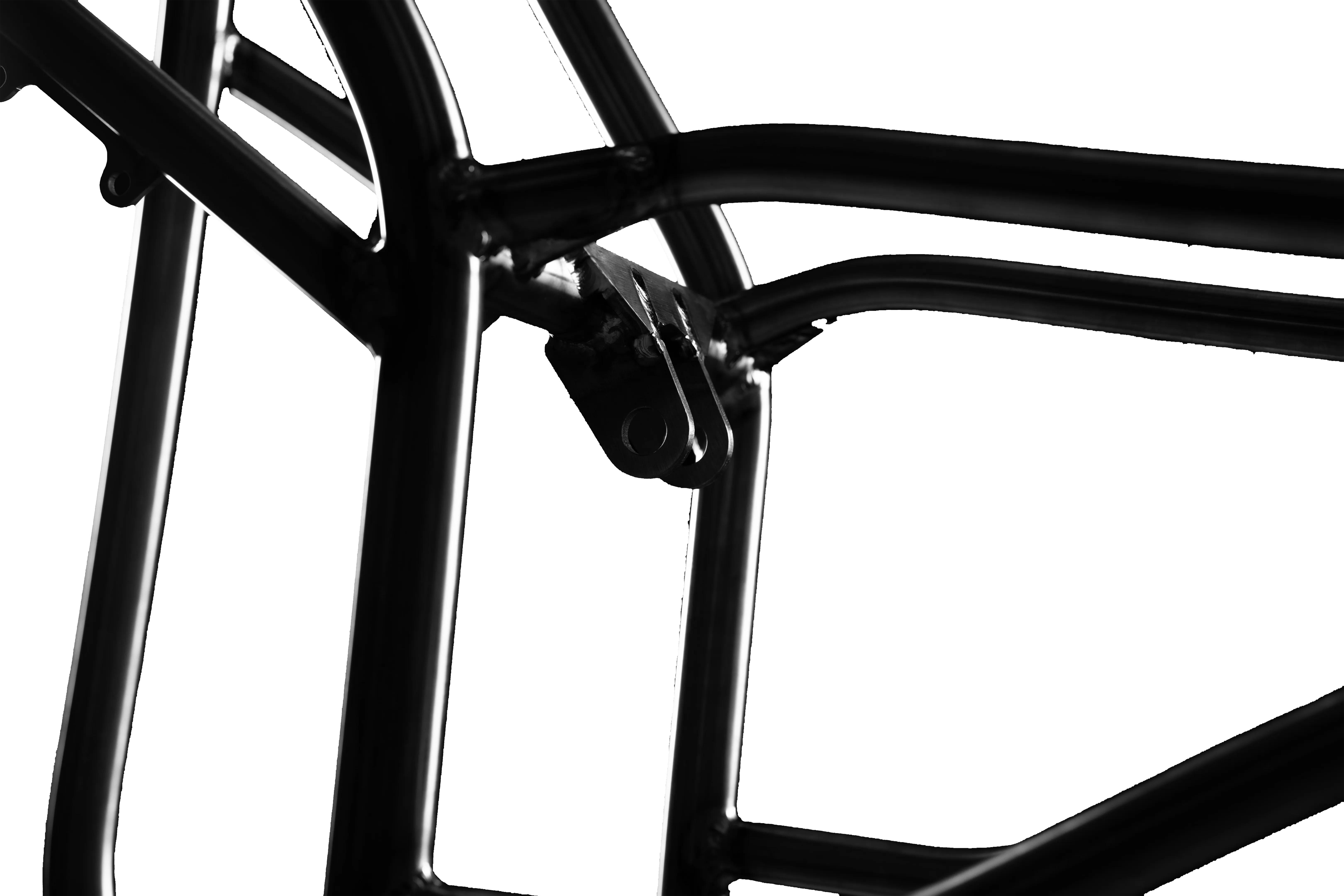 Close-up of a black metal frame structure with welded joints and a mounting bracket.