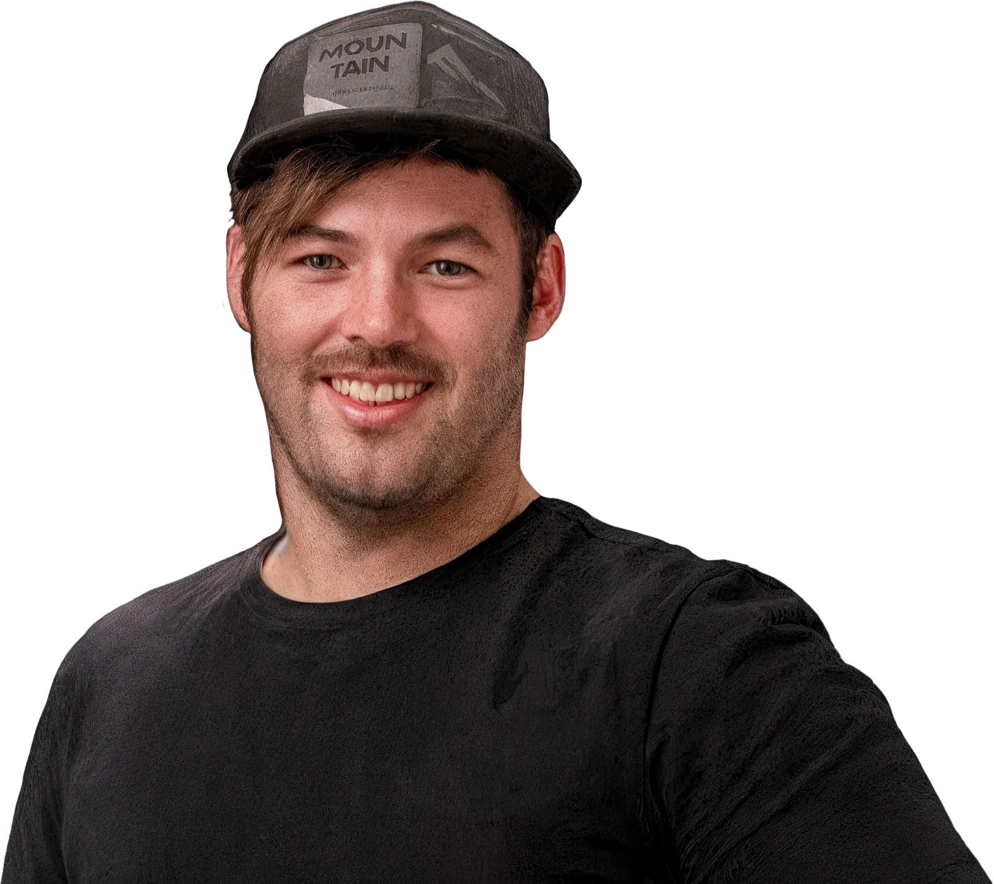 Smiling man wearing a black baseball cap with 'MOUNTAIN' text and a black t-shirt.