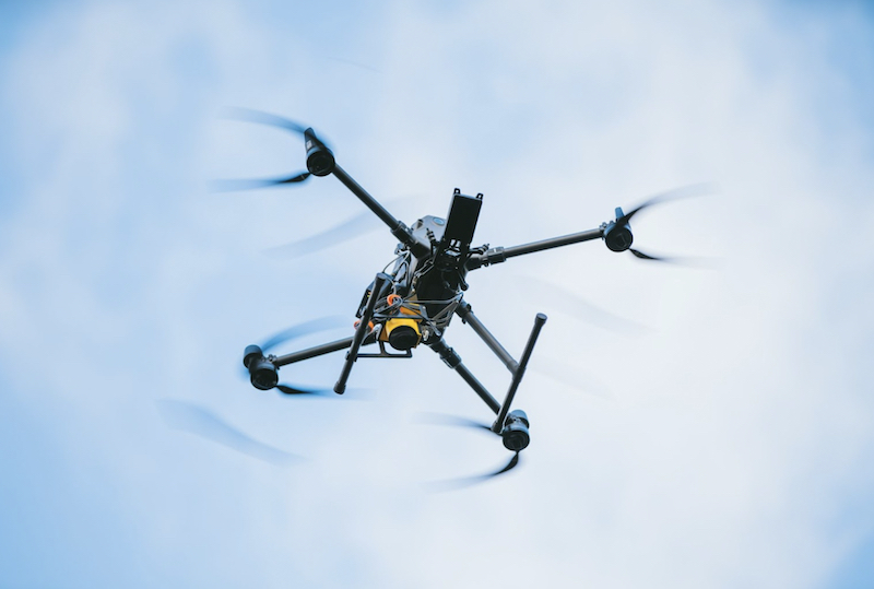 image of drone surveying crops