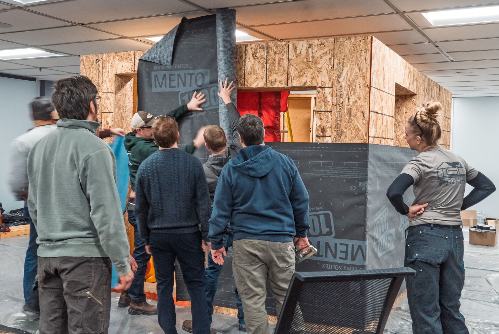 A group of participants taking part in the Certified Passive House Tradesperson course hosted by PlusBuild in collaboration with Wilson Architectural Design, Peel Passive House, Point Engineering, Quantum, and Retrofit. 