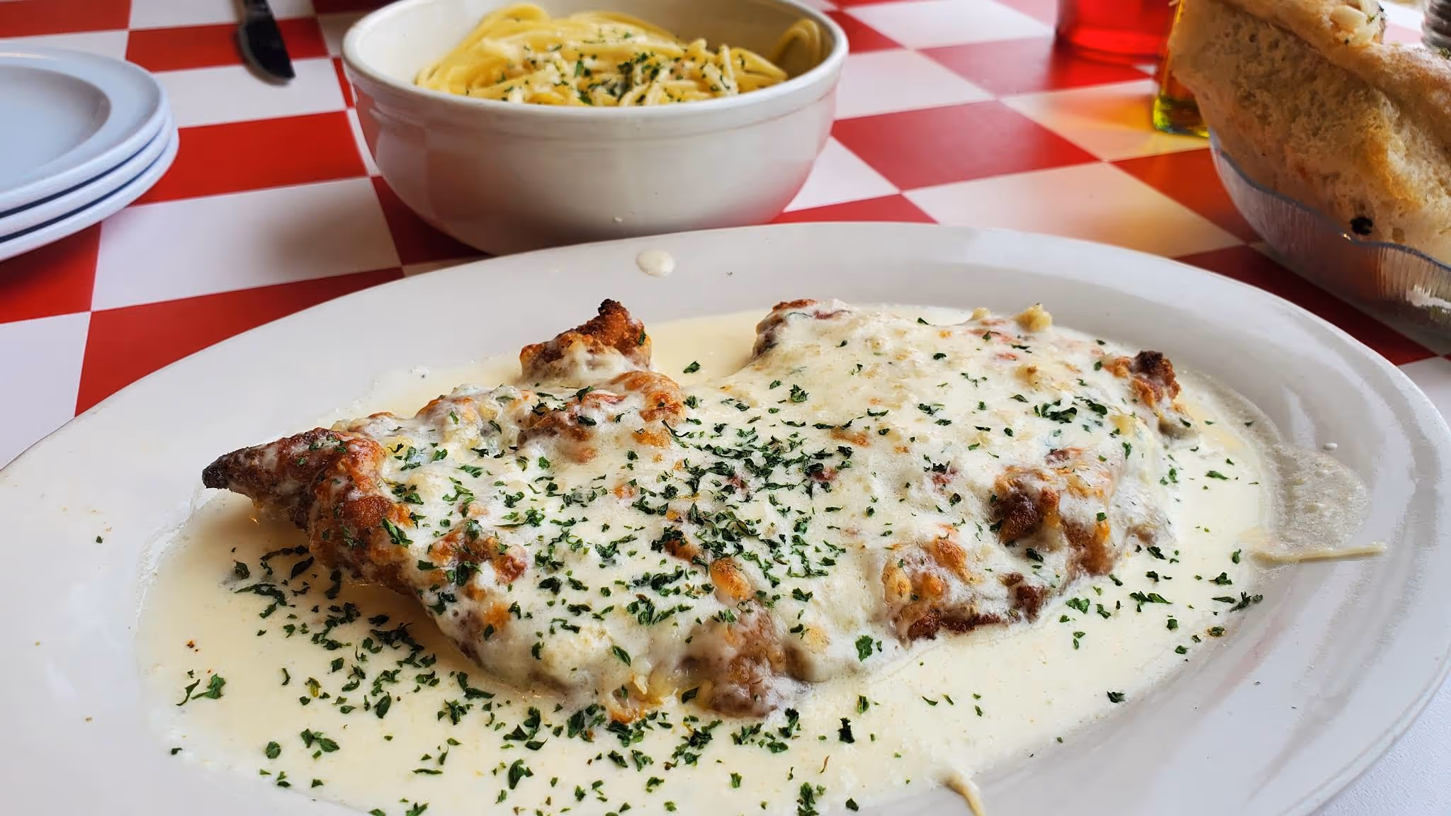 A plate of food with a white sauce on it.
