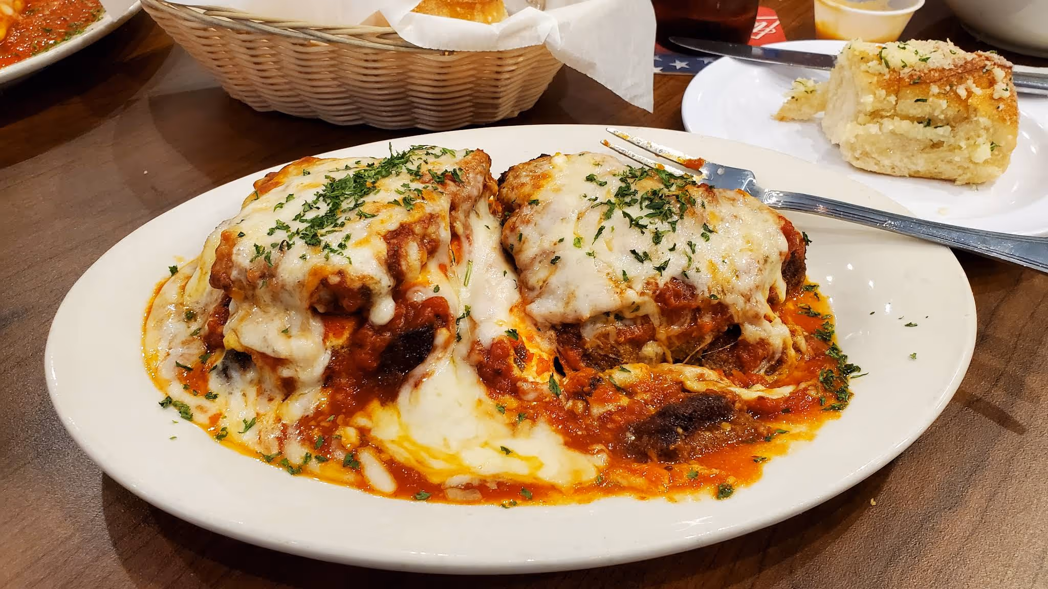 A plate of food with a fork and knife on it.