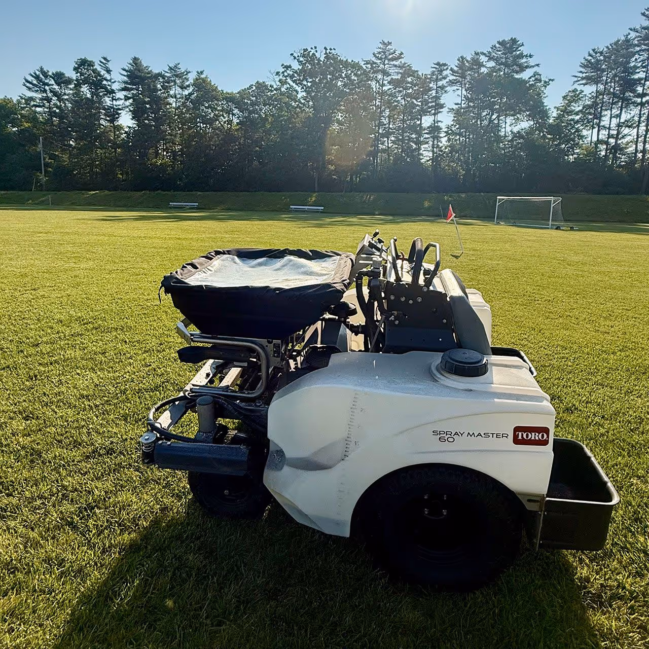 Professional lawn fertilization application promoting thick, green turf growth in Lakeville MA