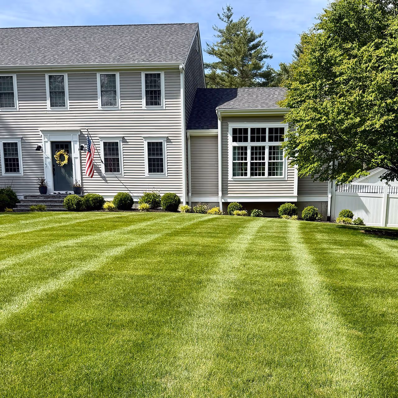 Freshly mowed lawn with clean stripes in Lakeville MA