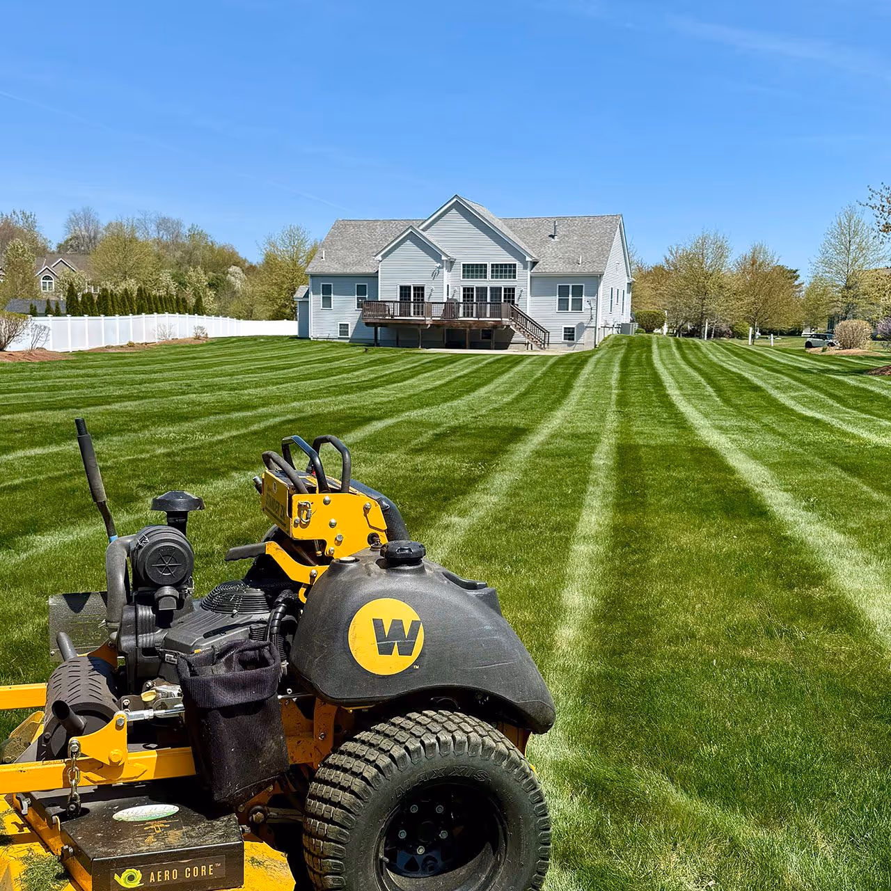 Professional lawn striping pattern after expert mowing service in Lakeville MA