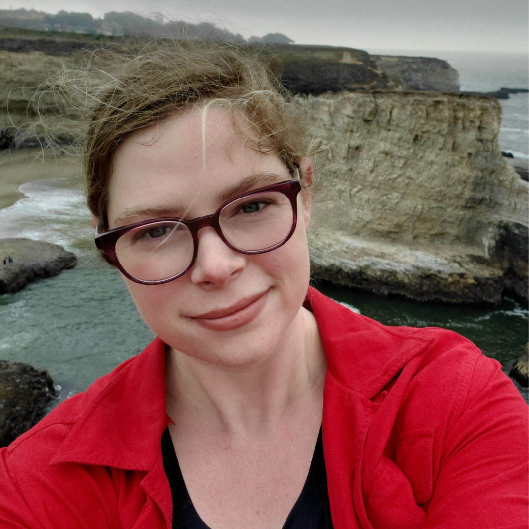 Emily takes a selfie in front of the ocean