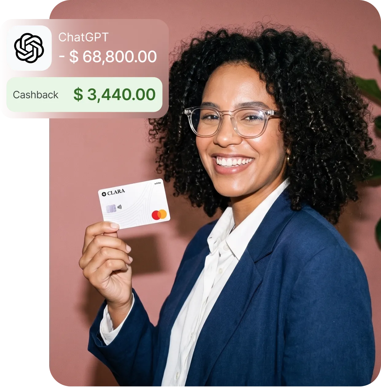 Smiling woman in glasses and blue blazer holding a Clara Mastercard with cashback and expense overlay.