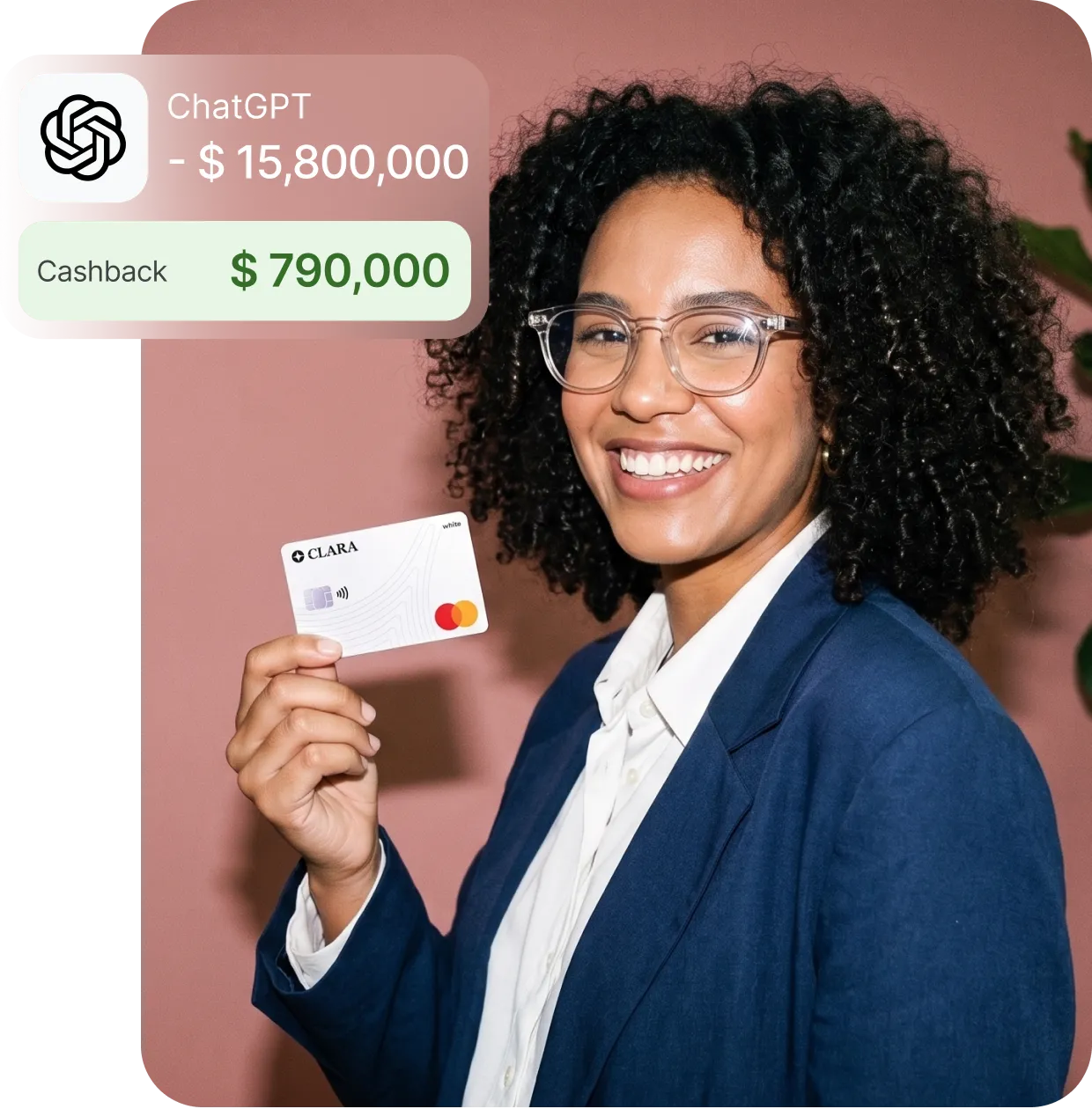 Smiling woman with glasses and curly hair holding a Clara Mastercard with cashback offer.