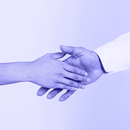 2 people holding hands in support