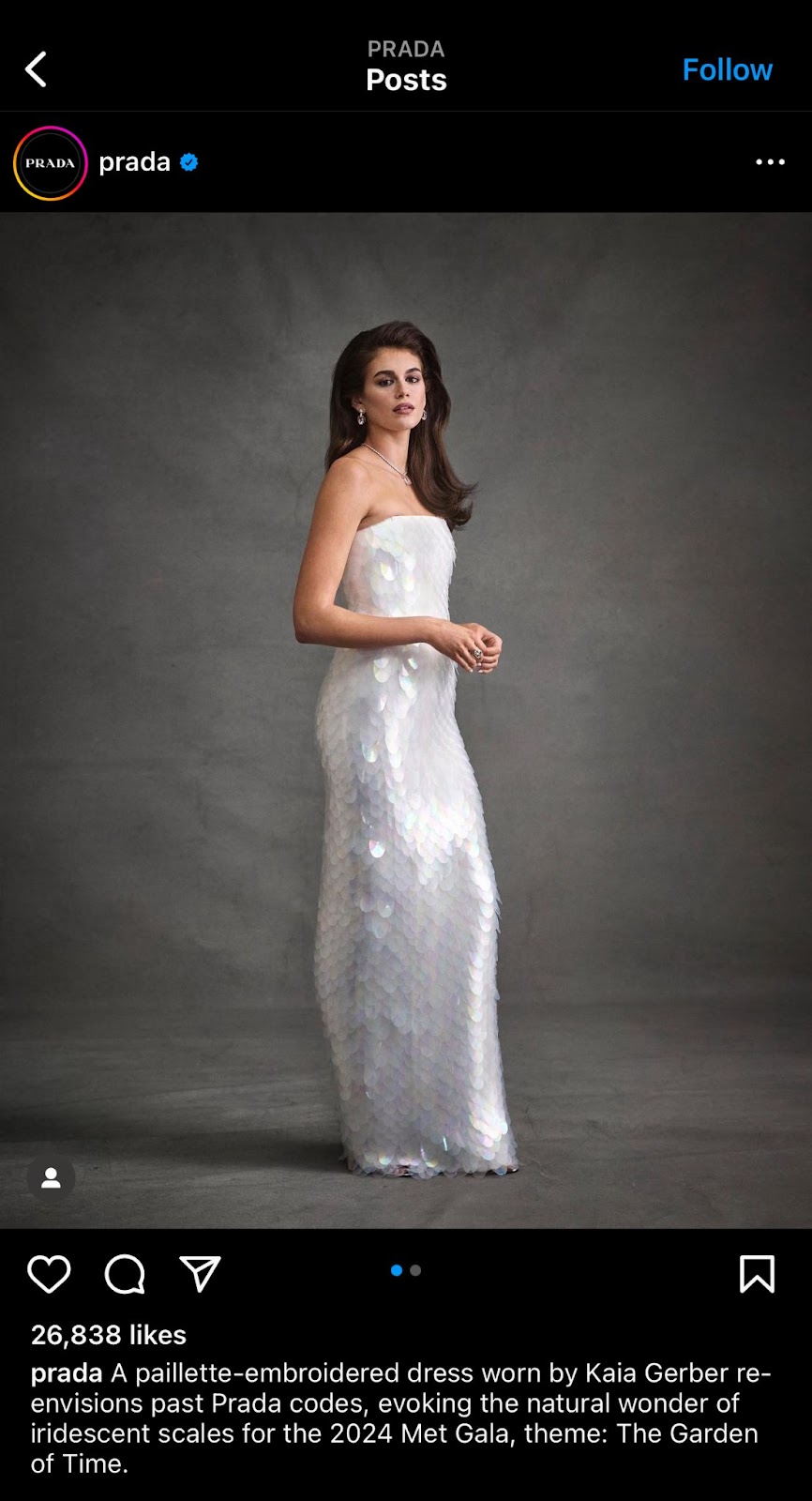 Kaia Gerber modeling for Prada met gala 2024 looks wearing a white dress
