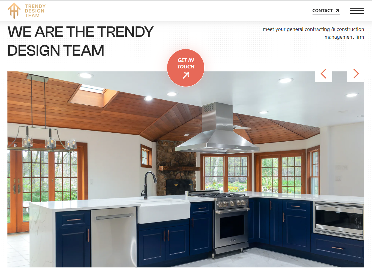 a large pretty house with big windows and green plants outside