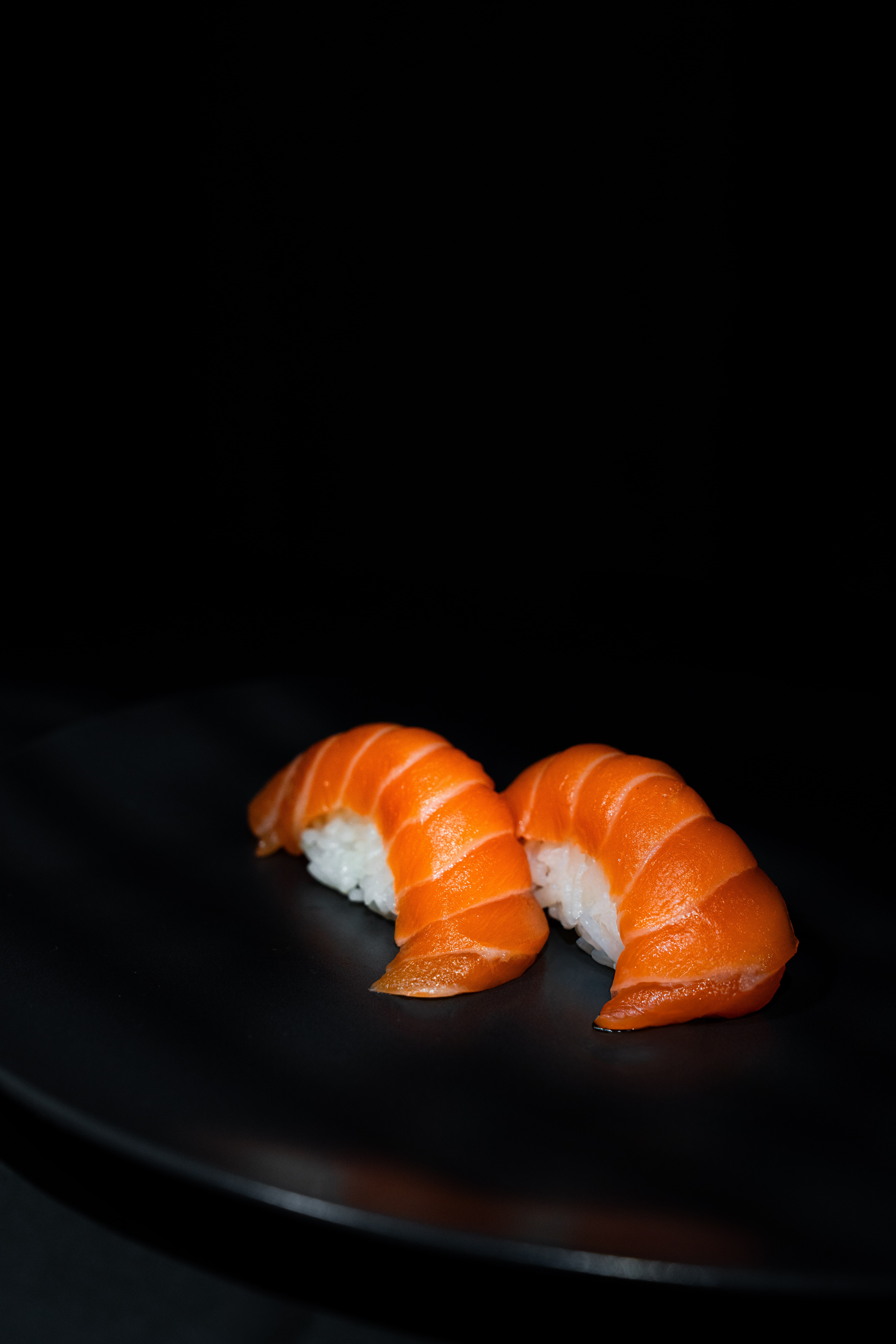 Close-up of sushi in a film-style scene with shallow focus and warm tones.