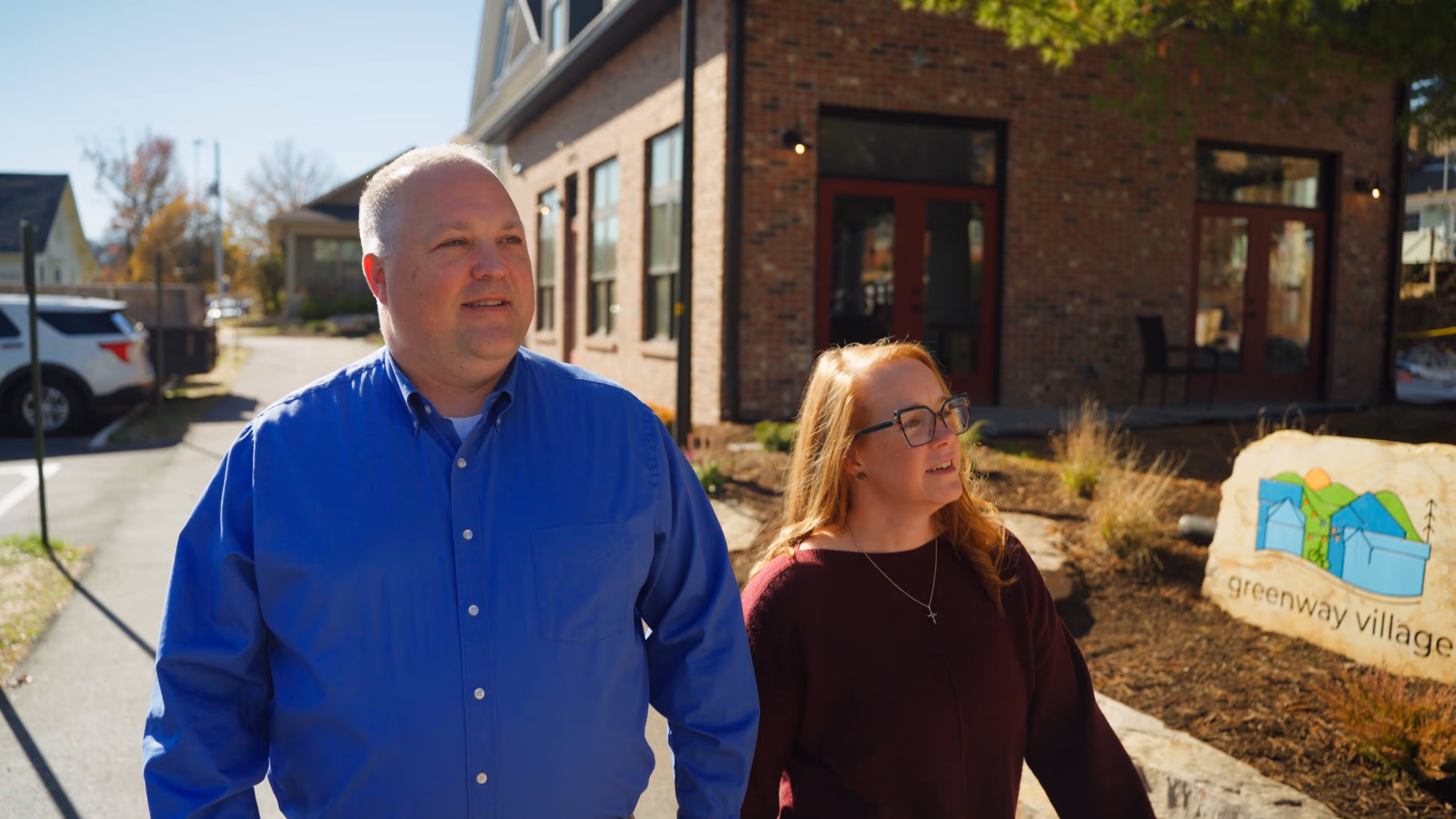 Amanda and her husband walking to meet a client.