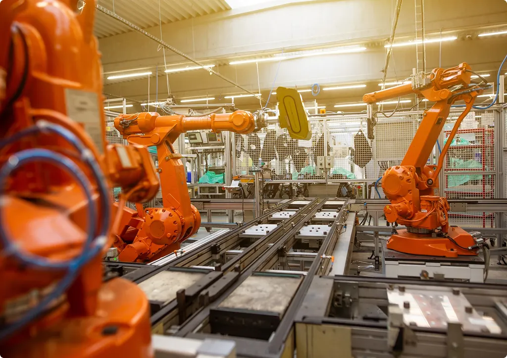 A factory filled with lots of orange machines.