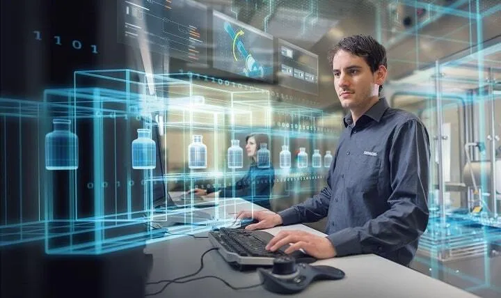 A man sitting at a desk with a keyboard and mouse.