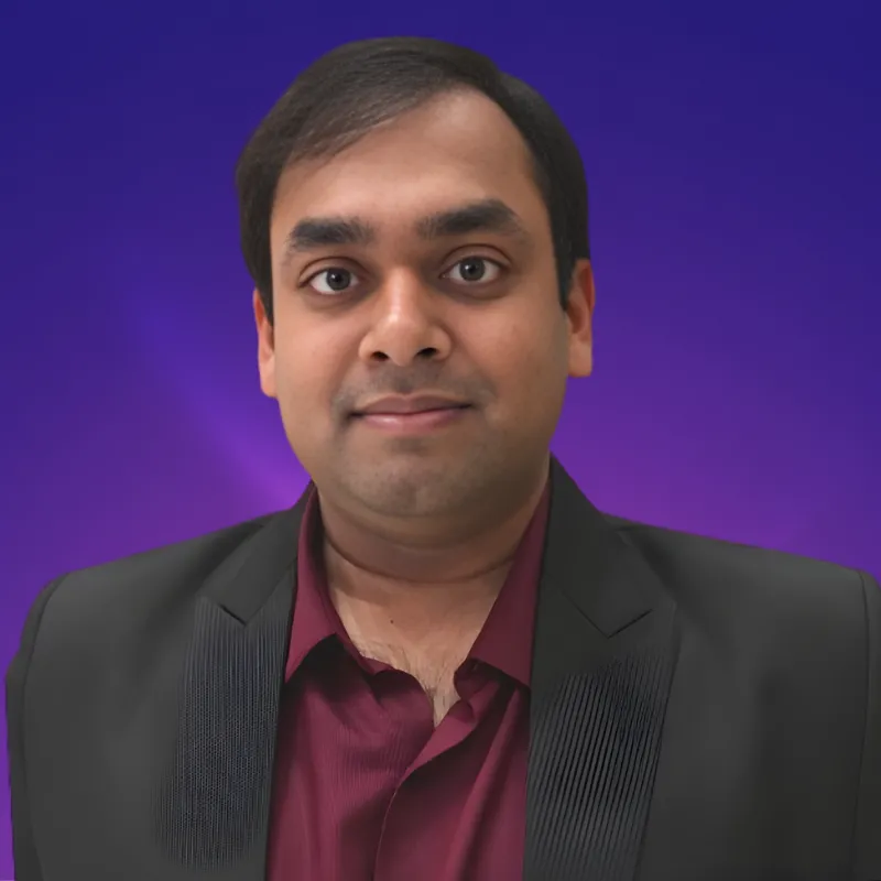 A man in a red shirt and black jacket.