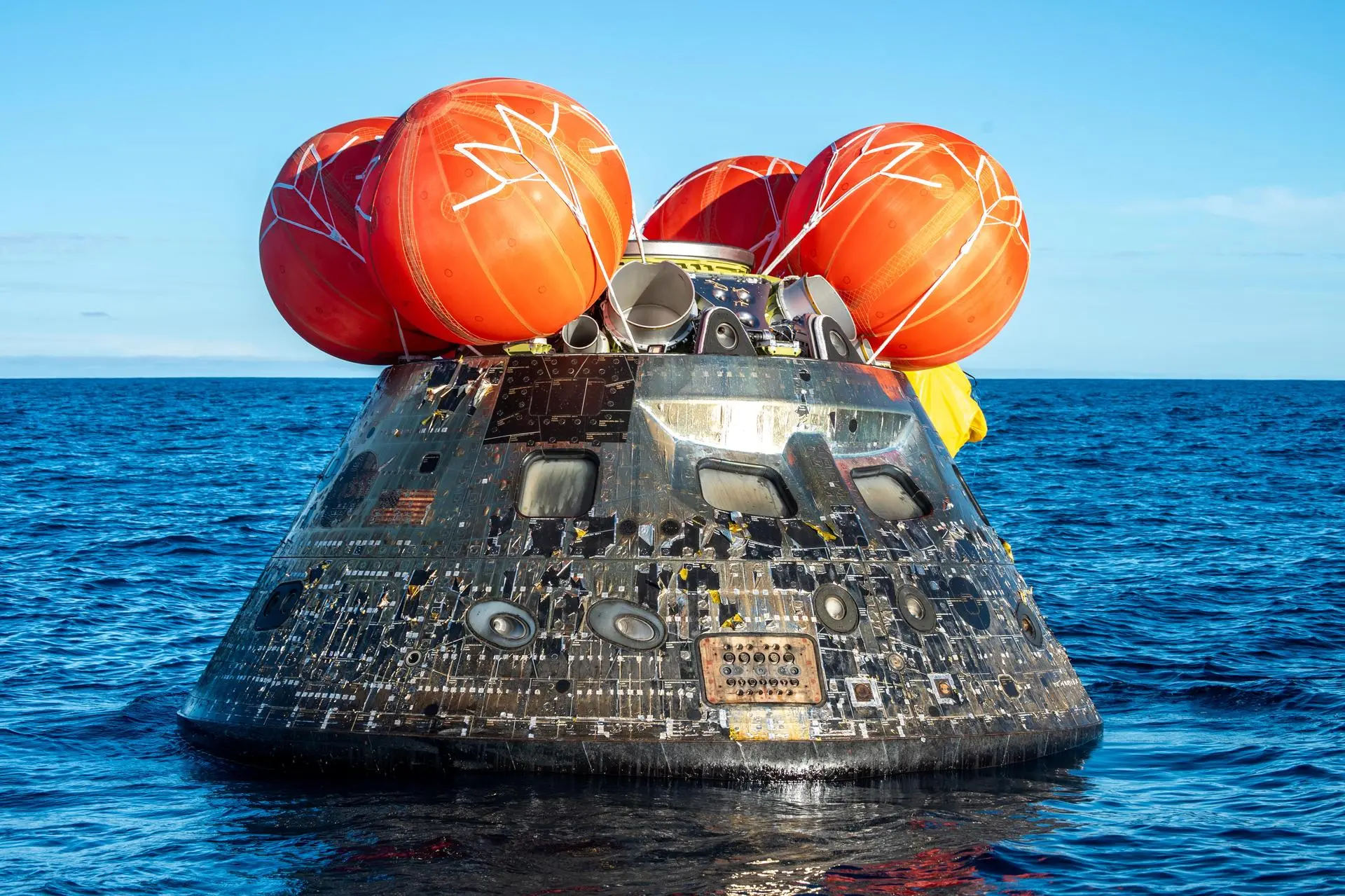 Orion crew module floating in the Pacific Ocean after successful Artemis II splashdown