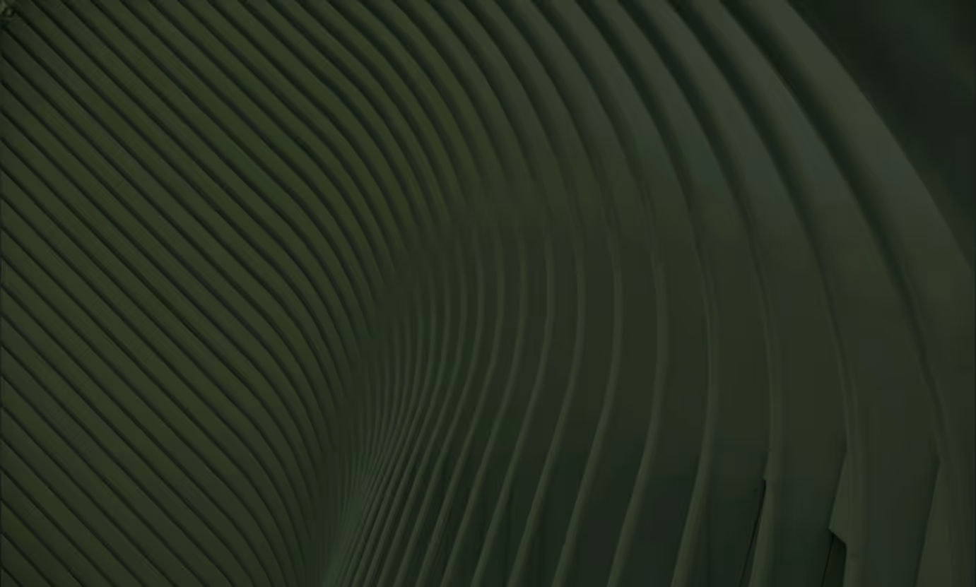 Close-up of a curved architectural structure with parallel green ribbed lines.
