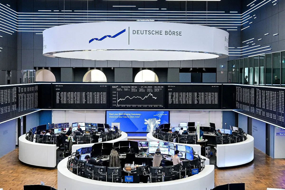 Interior view of the Deutsche Börse trading floor in Germany with multiple traders at circular desks surrounded by digital stock tickers.