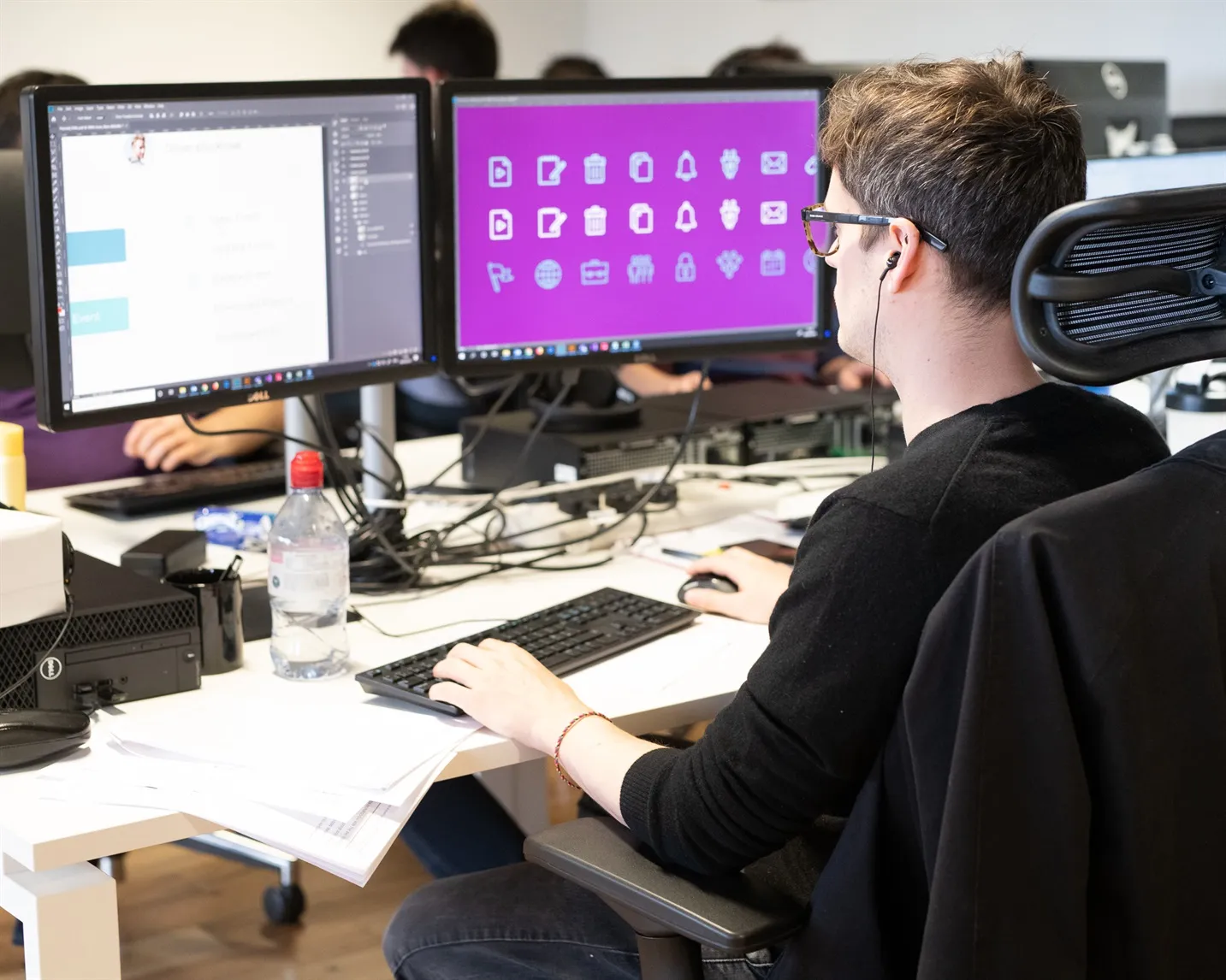 Team member working on icon designs