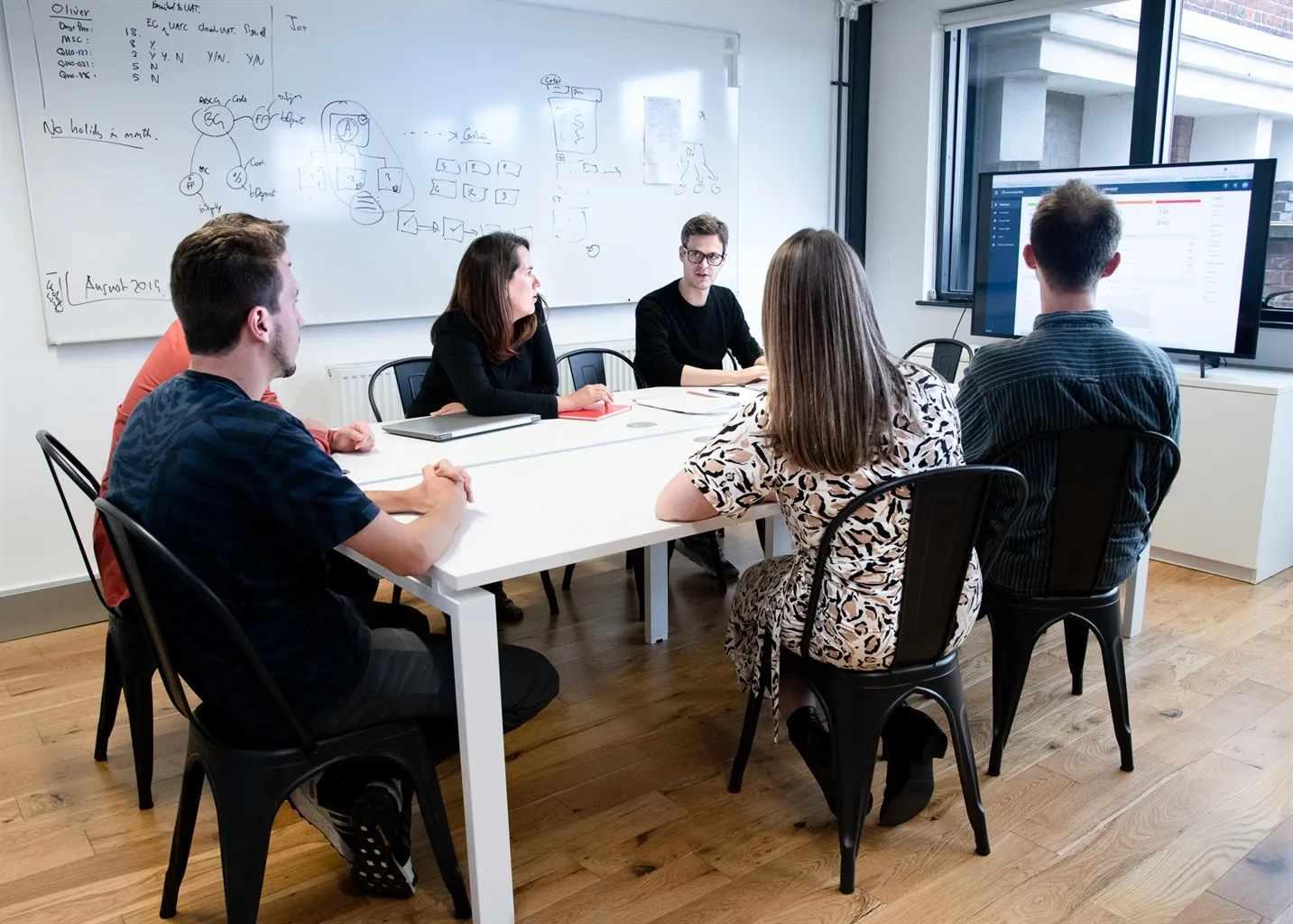 Team members in a meeting room