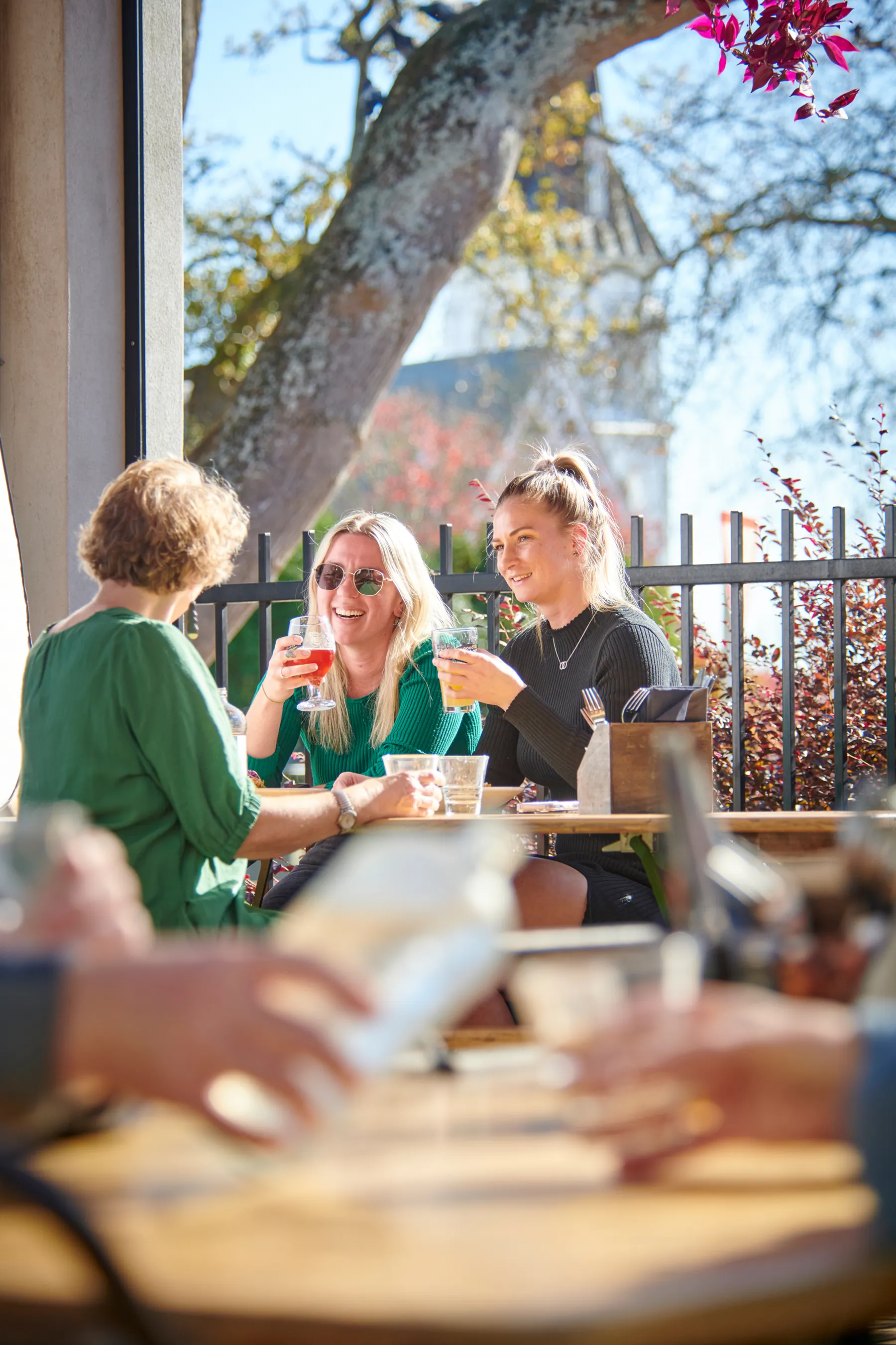 People having a drink in the sun in Cambridge