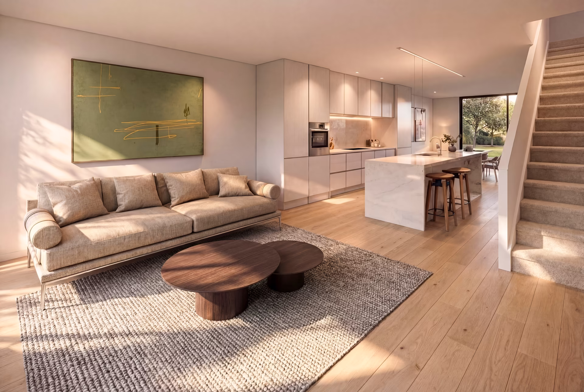Modern open living room and kitchen with beige sofa, round wooden coffee tables, a textured rug, marble kitchen island with stools, and a staircase.