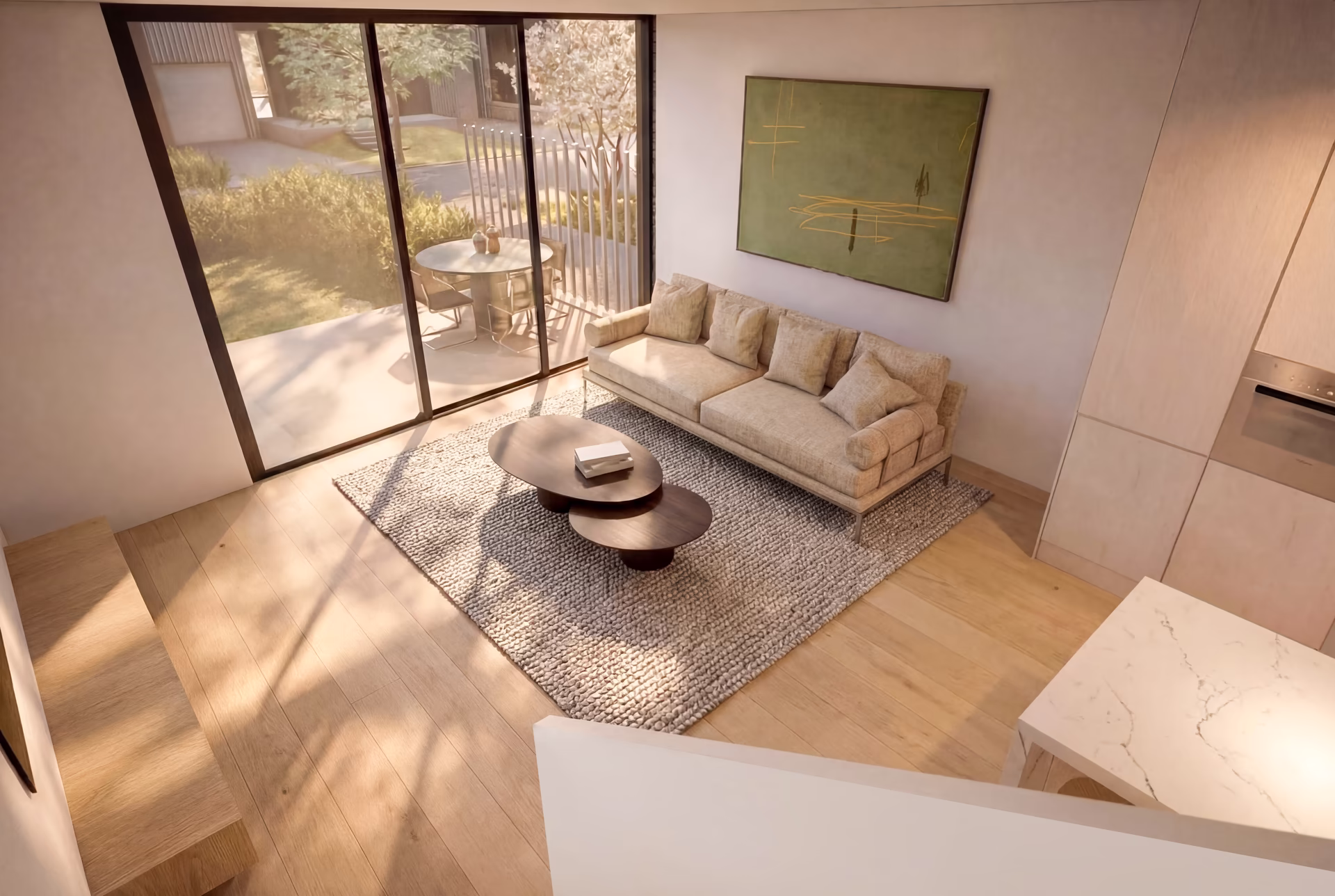 Modern living room with a beige sofa, two nested oval coffee tables on a textured rug, large sliding glass doors opening to a patio with a round table and chairs, and abstract green wall art.
