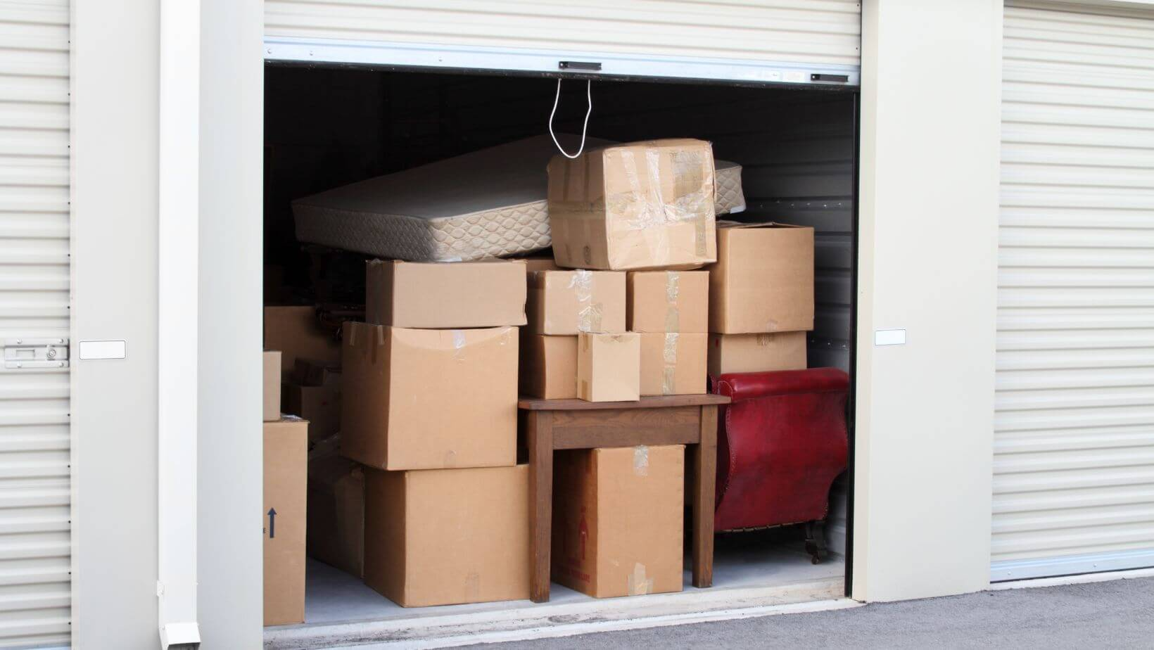 Open storage unit filled with boxes.