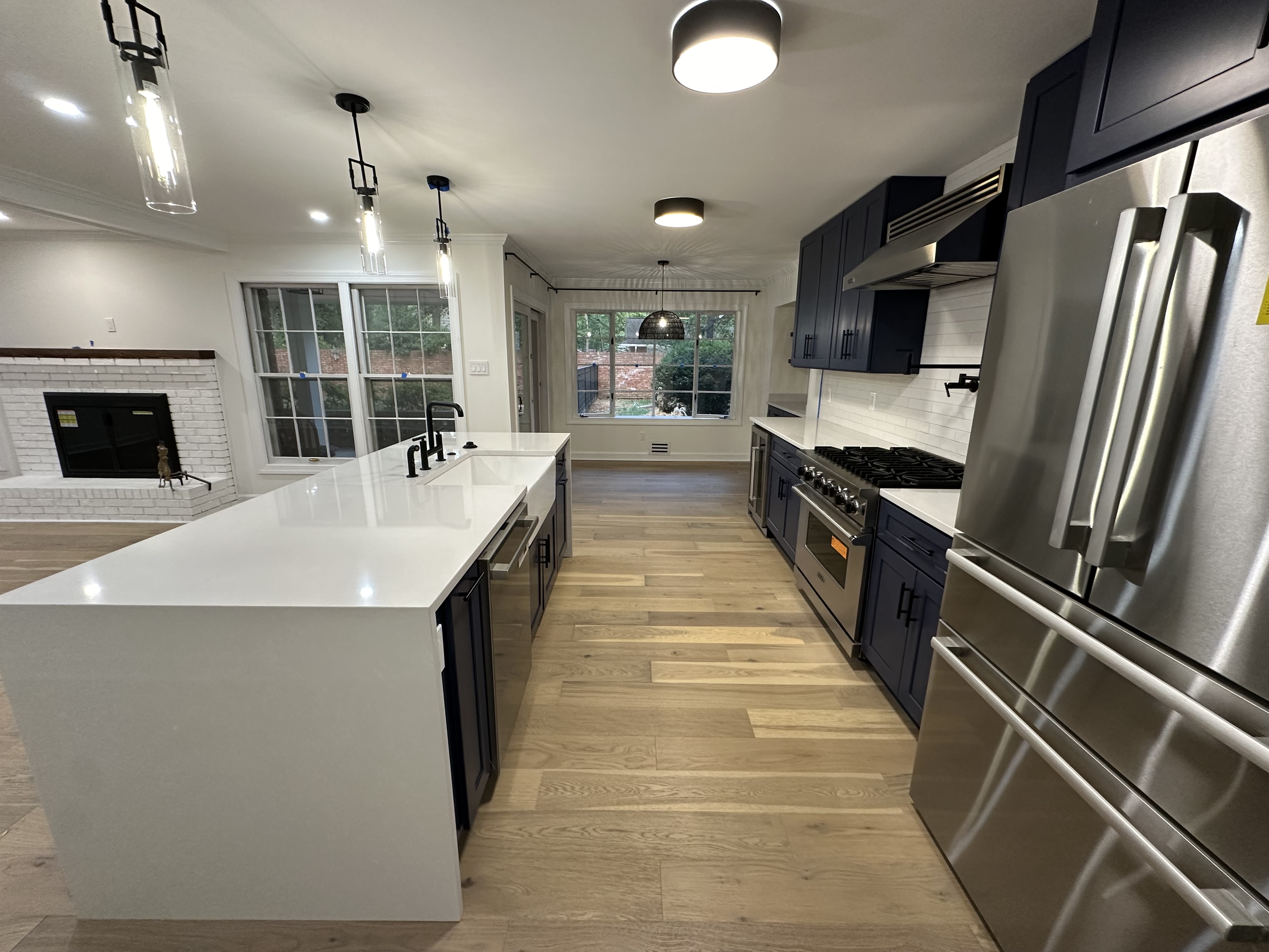 BHI Construction kitchen renovation Washington DC navy cabinets quartz island